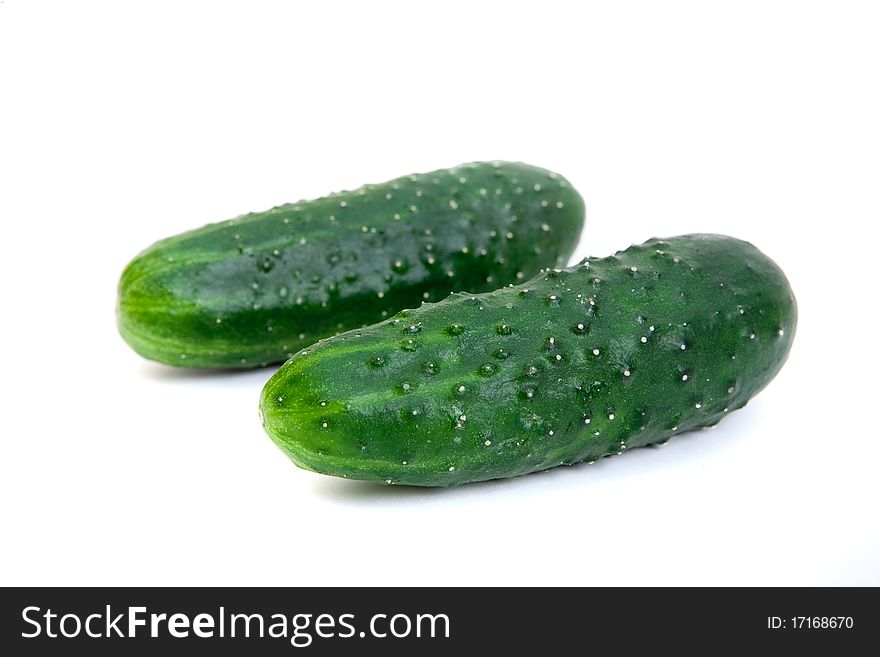 Healthy food. The green cucumbers isolated on whit