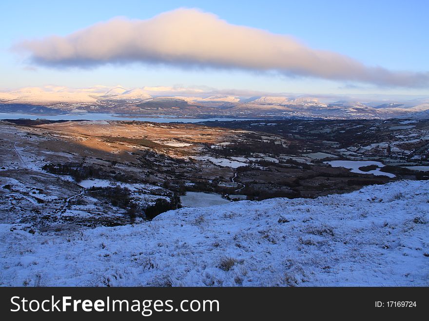 A snow covered valley with one ray of sun. A snow covered valley with one ray of sun.