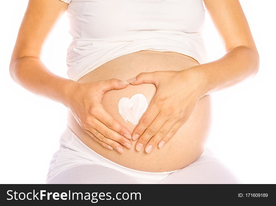 A Happy pregnant girl lies on white background