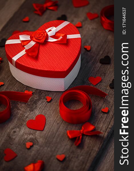 Love and holiday greeting concept background. Symbol of love. Red ribbon and heart decor. Love concept background