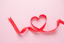 Red Ribbon In The Shape Of A Heart Stock Photos