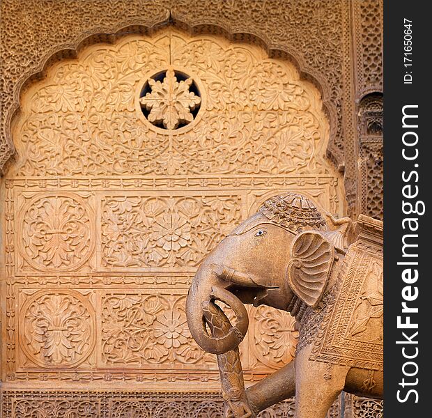 Ancient bas-relief and elephant statue on the street in Jaisalmer, Rajasthan, India