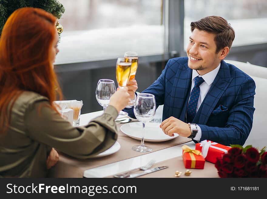 Young Caucasian Couple Celebrating Saint Valentines Day In Restaurant