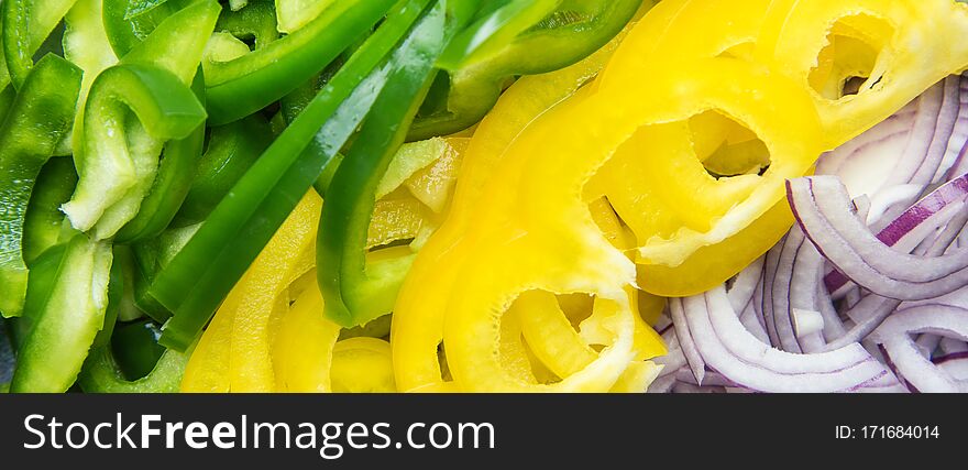 Imported Vegetables Concept. Sliced Ingredients Of Salad. Red Onions And Sweet Pepper