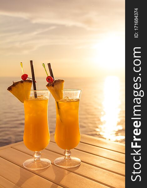 Fresh cool juicy orange pineapple coktails. Perfect wellness drink for enjoyment and relaxation at holiday cruise or vacation travel. Fresh cool juicy orange pineapple coktails. Perfect wellness drink for enjoyment and relaxation at holiday cruise or vacation travel