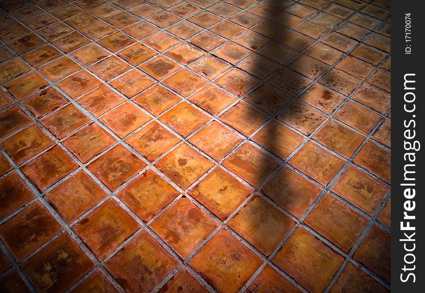 Top Perspective of Square red tiles floor with shadow