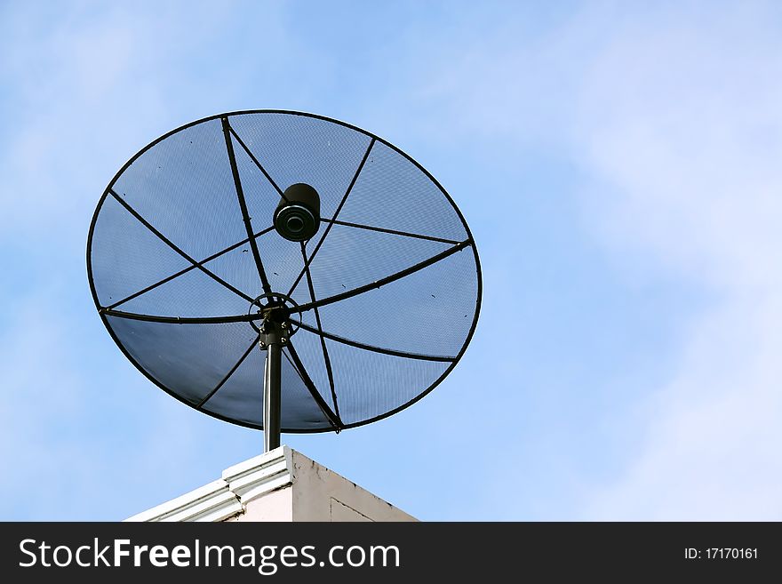 big black satellite dish, blue sky