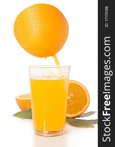 Orange juice and freshly squeezed orange