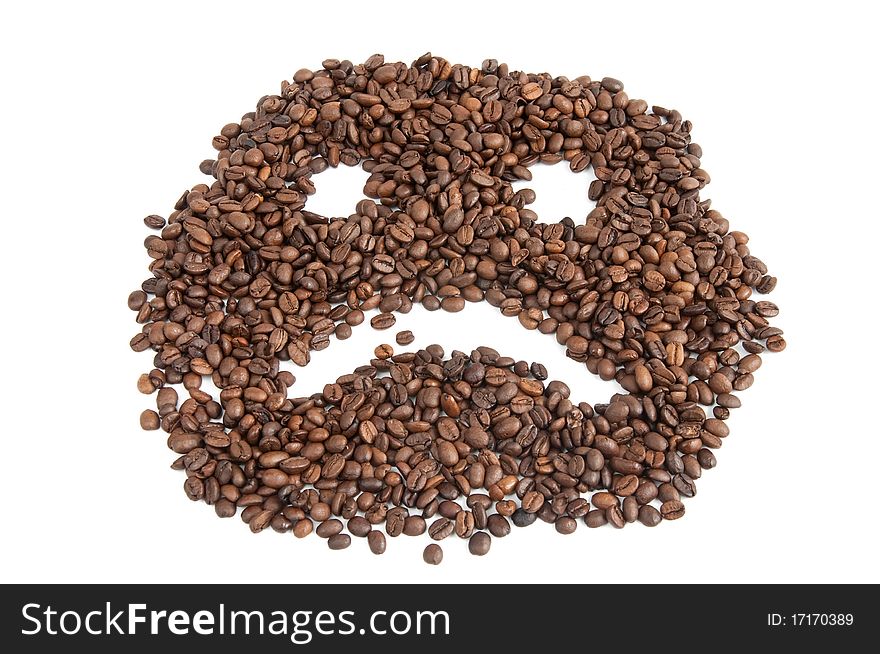 Coffee beans in the shape of a person with a smile