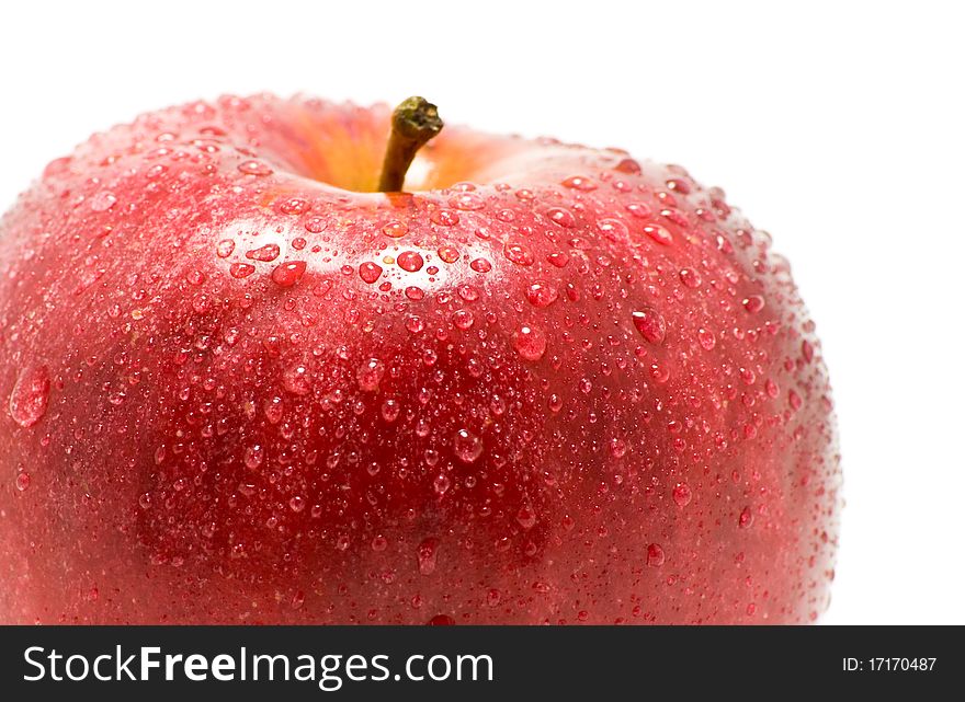 Ripe red apple in drop of water is insulated on white background. Ripe red apple in drop of water is insulated on white background