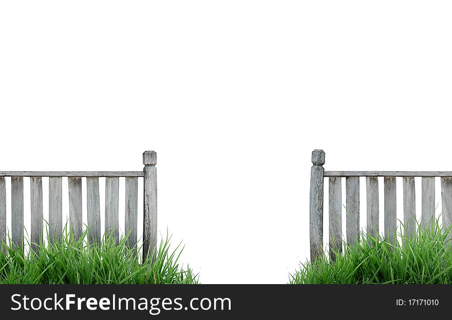 Old wooden fence with grass isolated