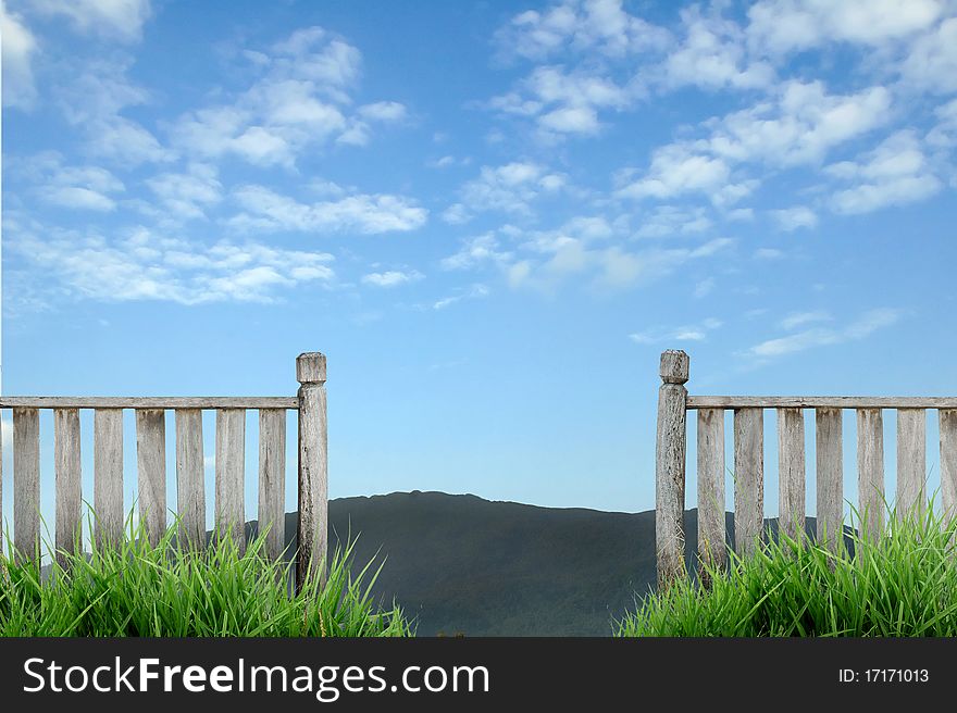 Old wooden fence with blue sky. Old wooden fence with blue sky