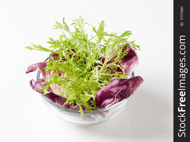 Bowl of fresh salad greens - studio