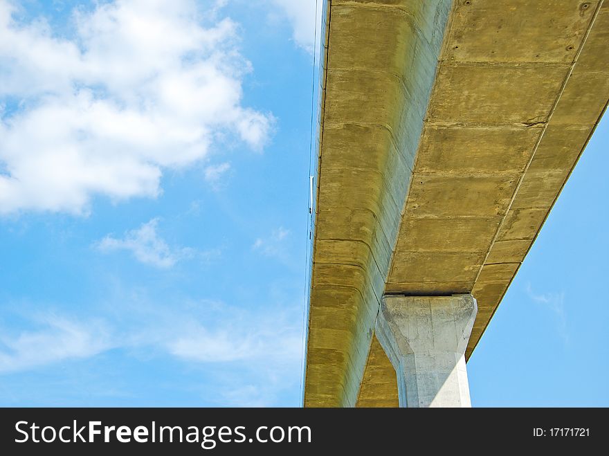 Under the highway with beautiful sky