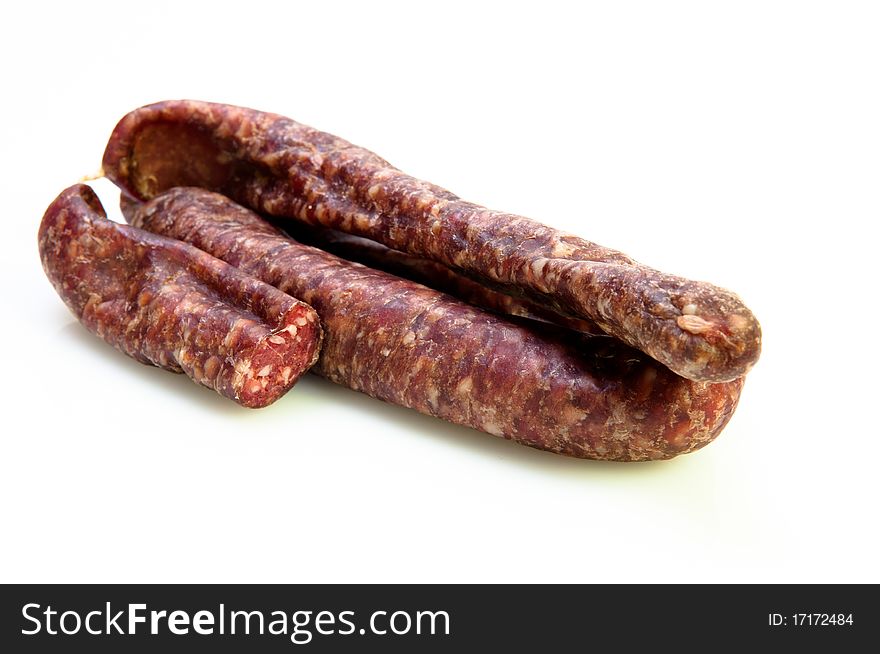 Sausage Cut In Half On White Background