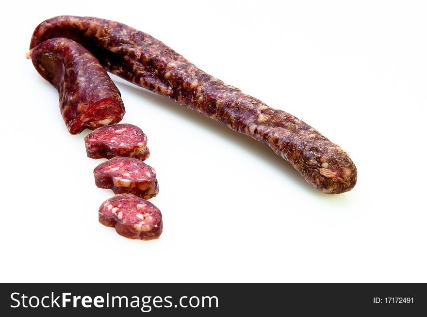 Sausage Sliced Up On White Background