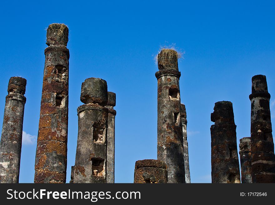 Ancient stone pillar with blue sky in the historic national park in Thailand. Ancient stone pillar with blue sky in the historic national park in Thailand