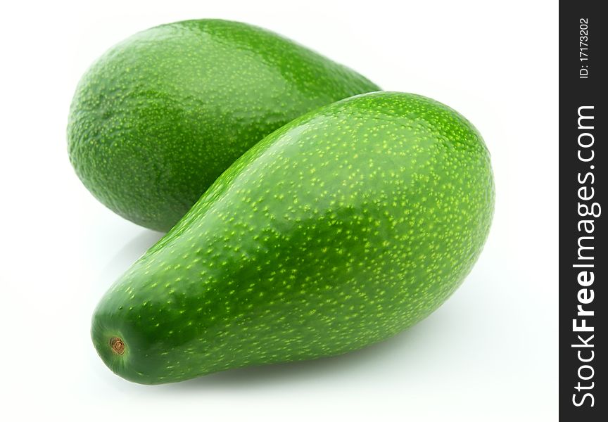 Two ripe avocados on a white background. Two ripe avocados on a white background