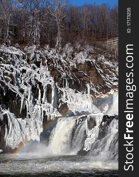 Rainbow on frozen water cascade. Rainbow on frozen water cascade