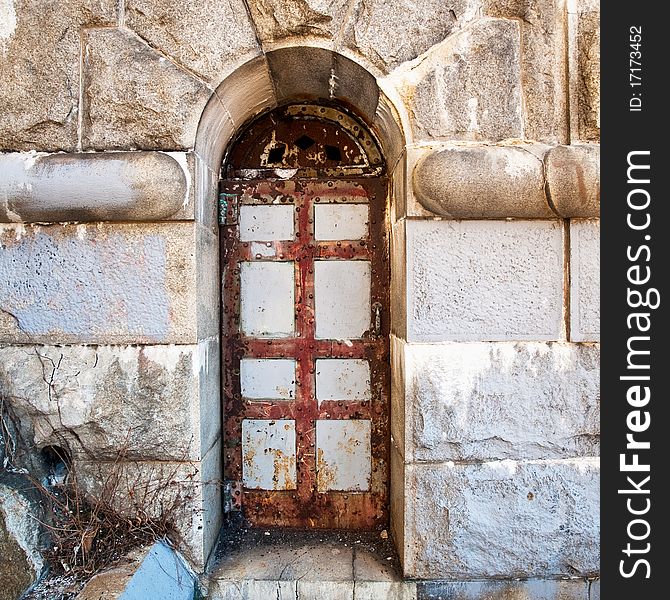 Old rusty door in dam wall