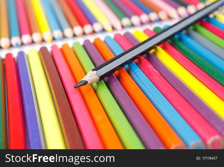 A lot of colored pencils on white background. A lot of colored pencils on white background