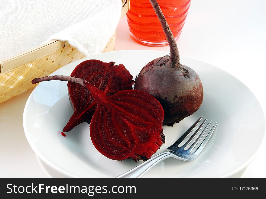 Juicy red beet on a white plate. Juicy red beet on a white plate