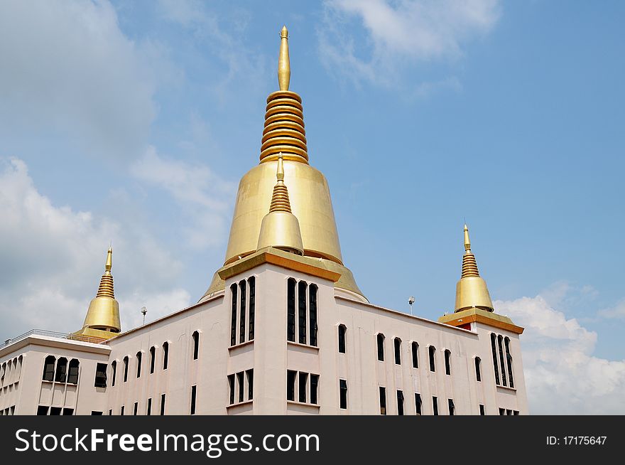 Buddhist Temple With Golden Stupa