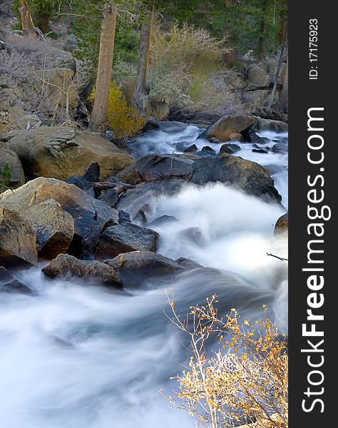 Artistic creamy river rapids with rocks. Artistic creamy river rapids with rocks