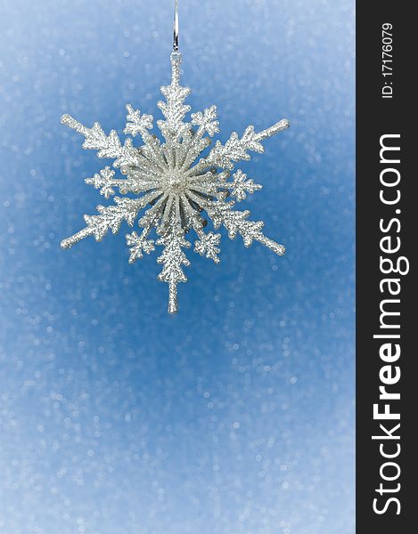 Silver Christmas snowflake  on blue background