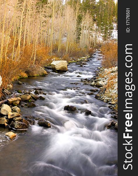 Artistic creamy river rapids with rocks. Artistic creamy river rapids with rocks