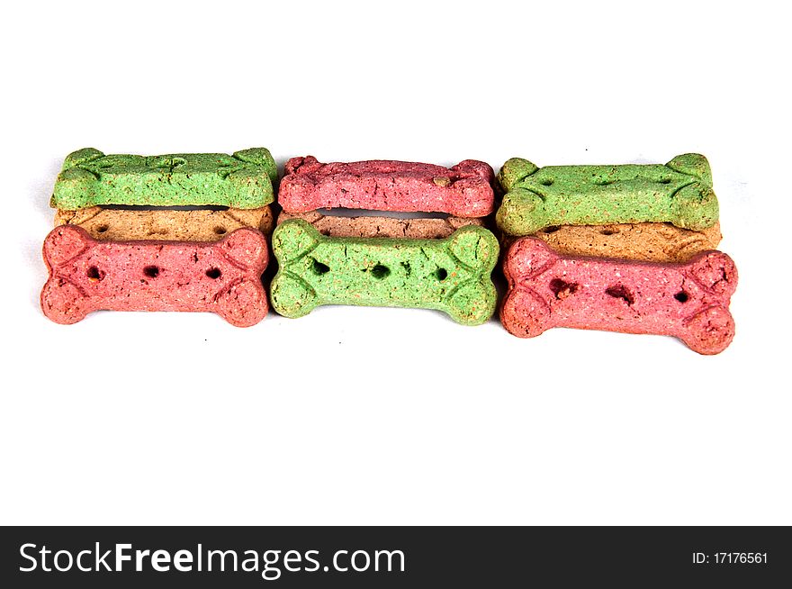 Multicolored dog treat biscuits, isolated on white