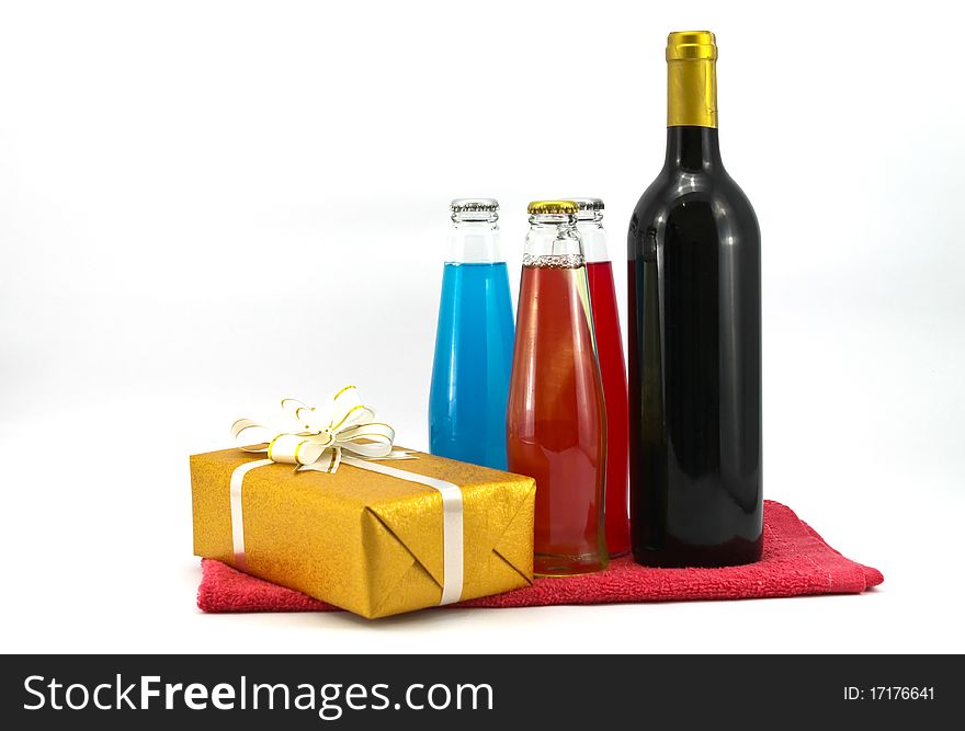 Wine bottle and gift isolated on white background