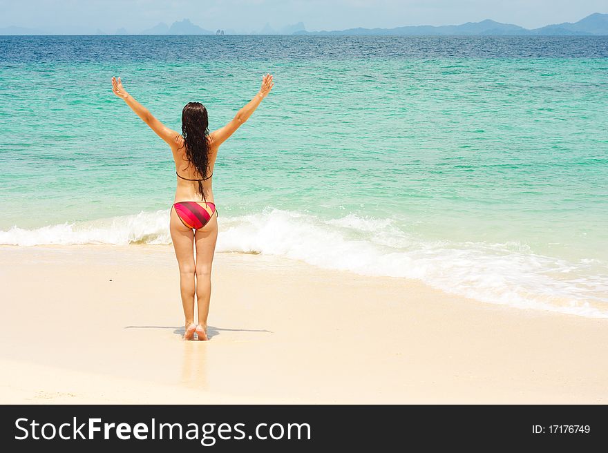 Young lady enjoying sunshine on beach. Young lady enjoying sunshine on beach
