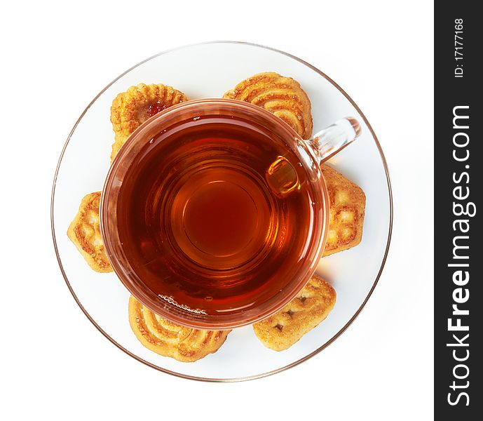 Cup of hot tea with cookies on a white background