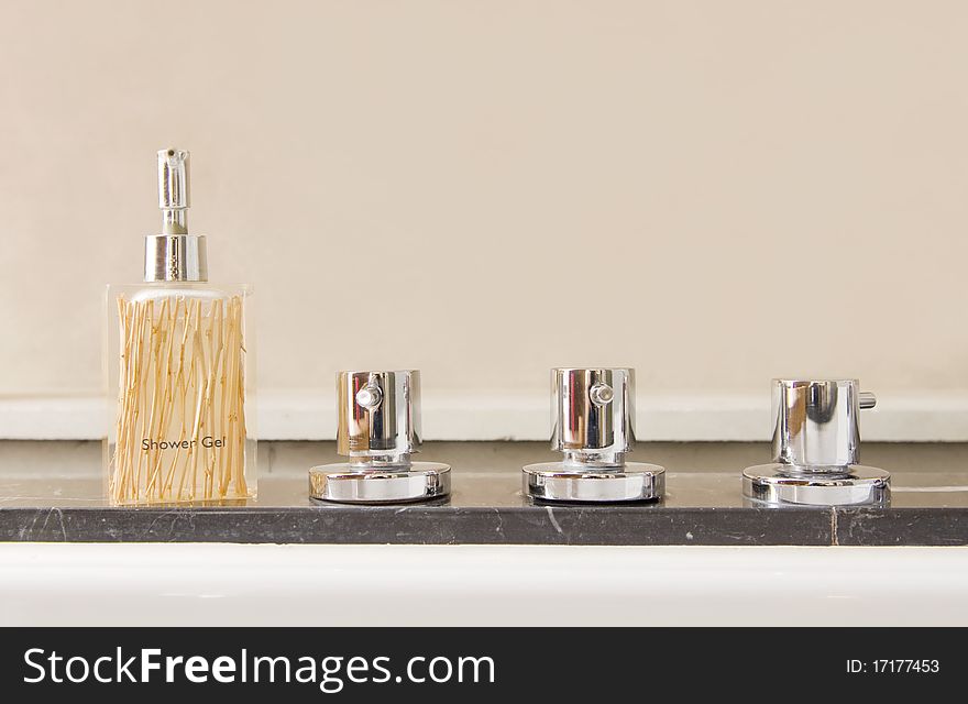 Modern stainless steel taps with shower gel