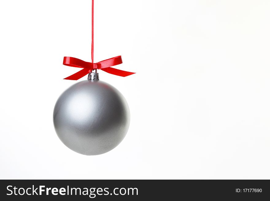 Christmas balls hanging with ribbons on white background