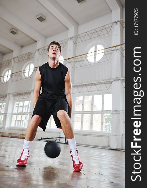 Young and healthy people man have recreation and training exercise while play basketball game at sport gym indoor hall. Young and healthy people man have recreation and training exercise while play basketball game at sport gym indoor hall