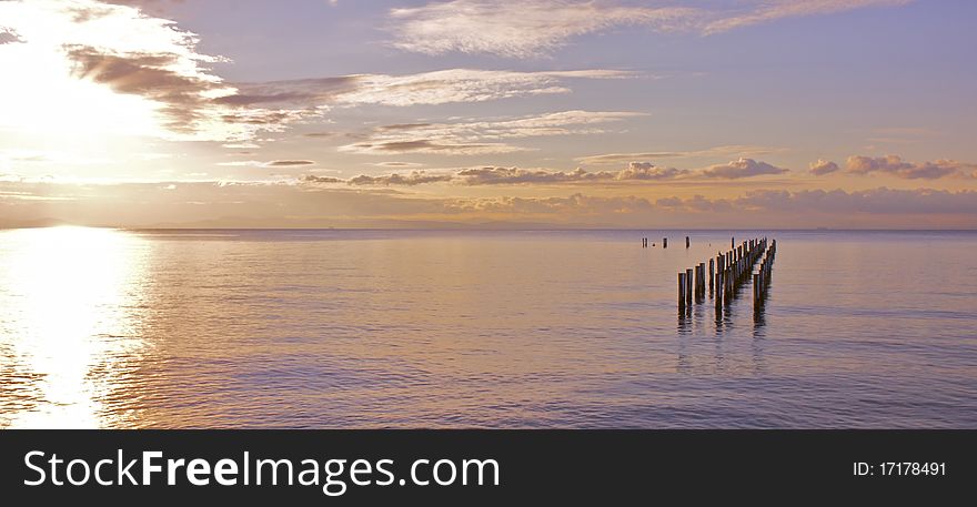 Sun setting on the water. Sun setting on the water.