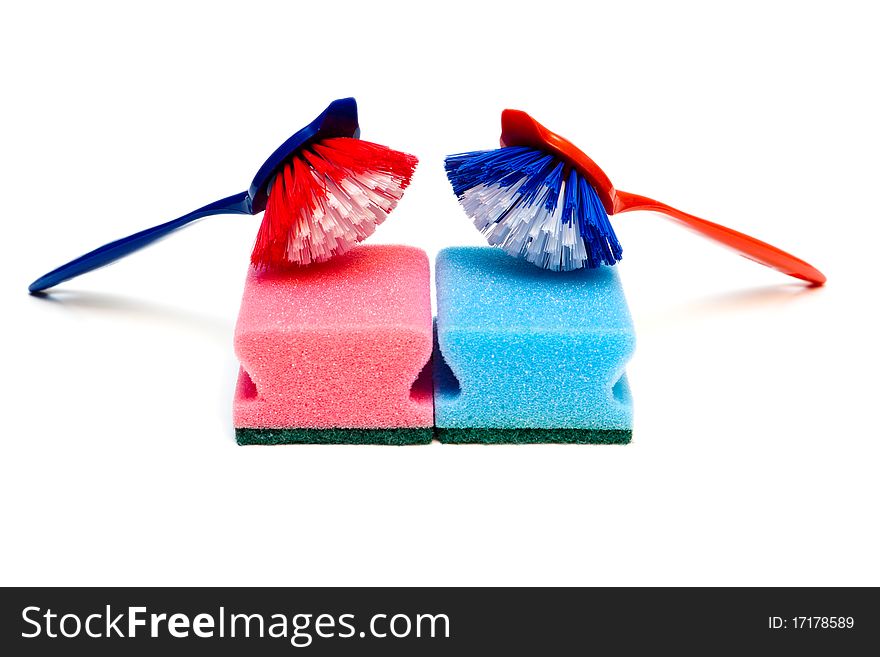 Cleaning brushes and kitchen sponges isolated on a white background.