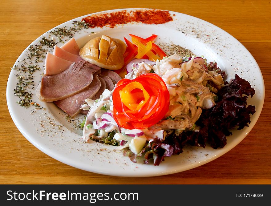 Festive dish with salad and ham