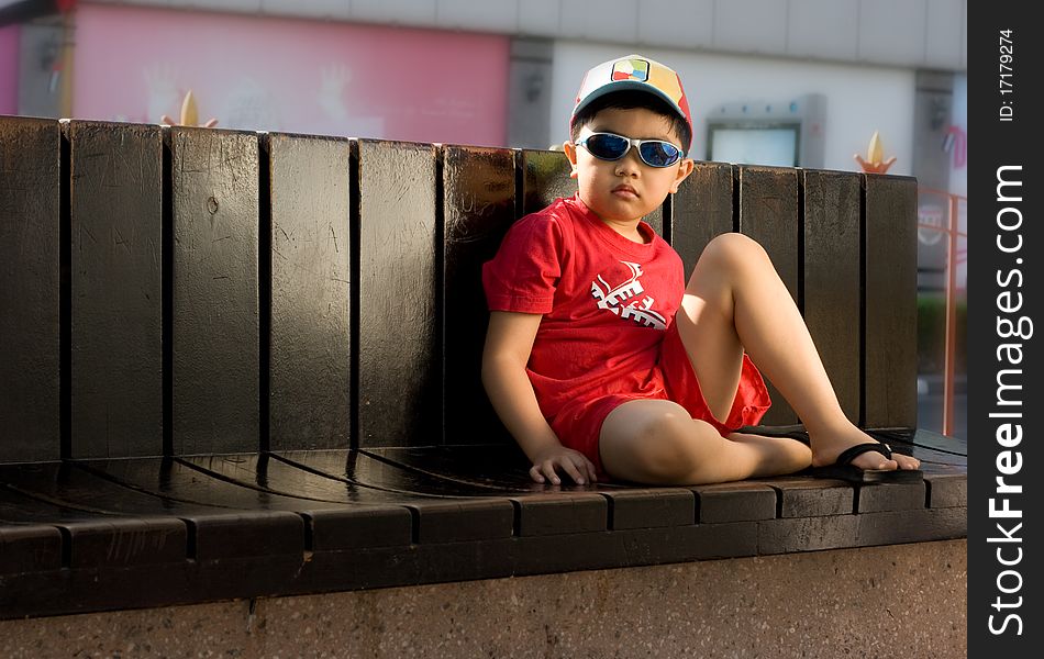 A boy wearing red shirt. A boy wearing red shirt.