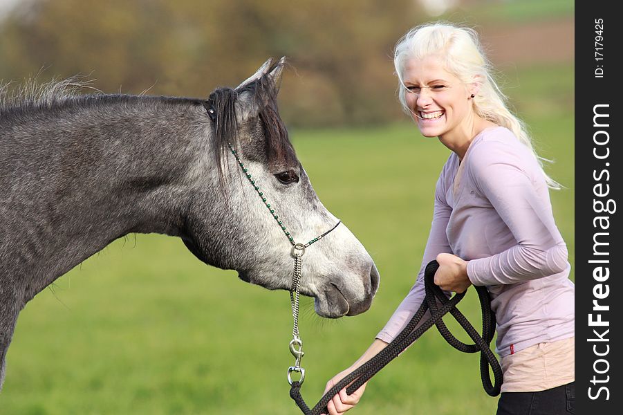 German beaty has really fun with her young Arabian mare. German beaty has really fun with her young Arabian mare