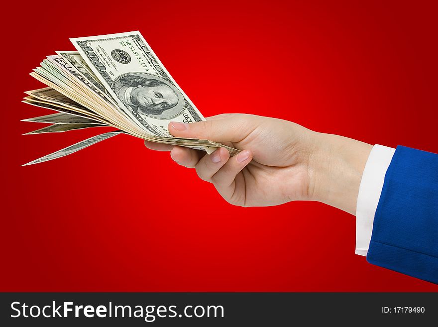 Dollars in hand on a red background + Clipping Path