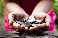 Coins Or Money In The Hands Of Men. Stock Photography