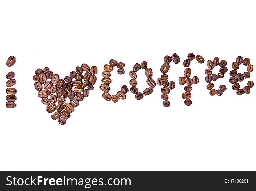 From coffee grains the word and an image of heart is laid out