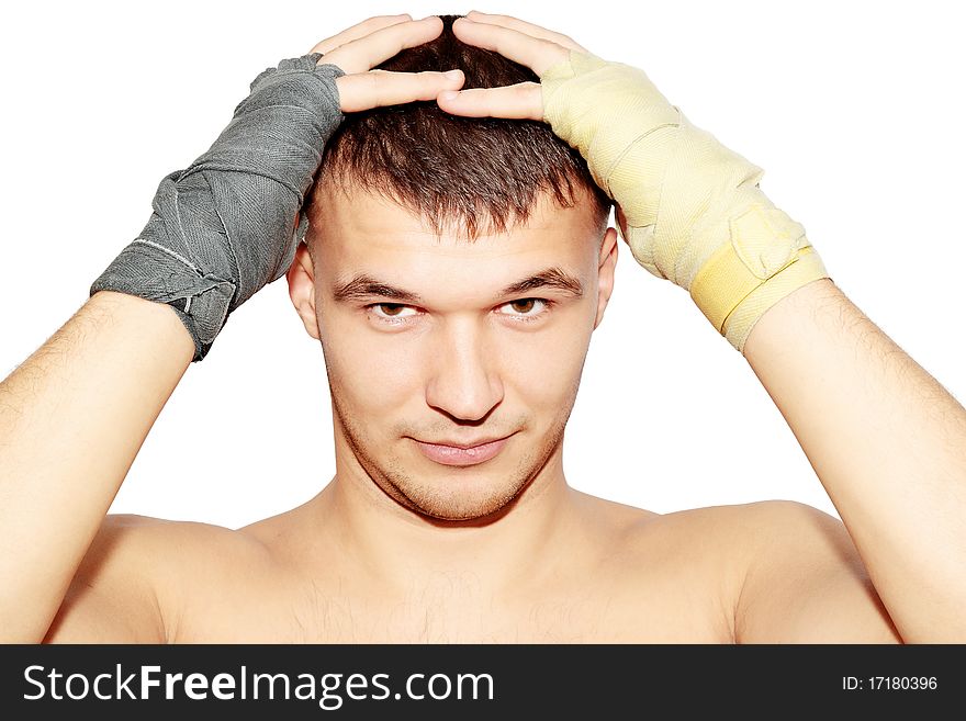 Man in the boxer bandages is held for the head