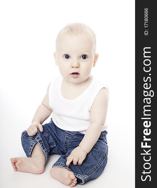 Cute baby boy in white vest