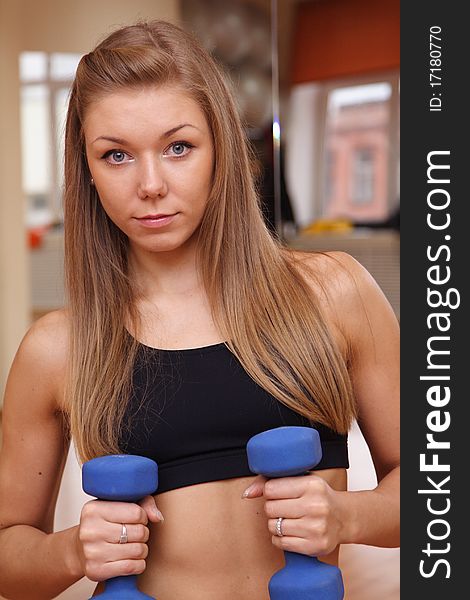 Girl Hold Dumbbells In Hand With Strong Abdomen