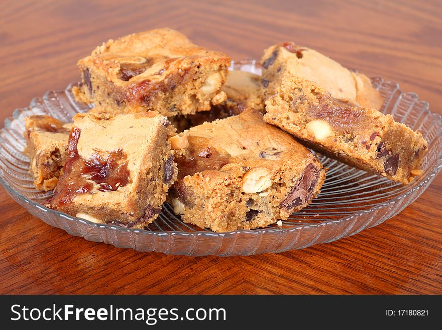 Pieces of peanut butter fudge on a glass plate