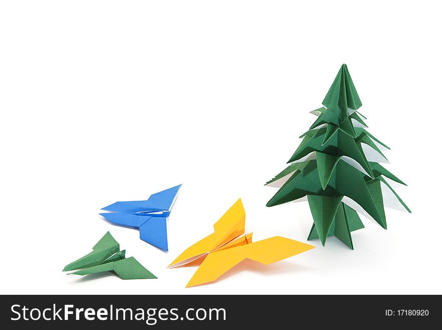 Traditional Japanese origami Christmas tree with butterflies isolated on white